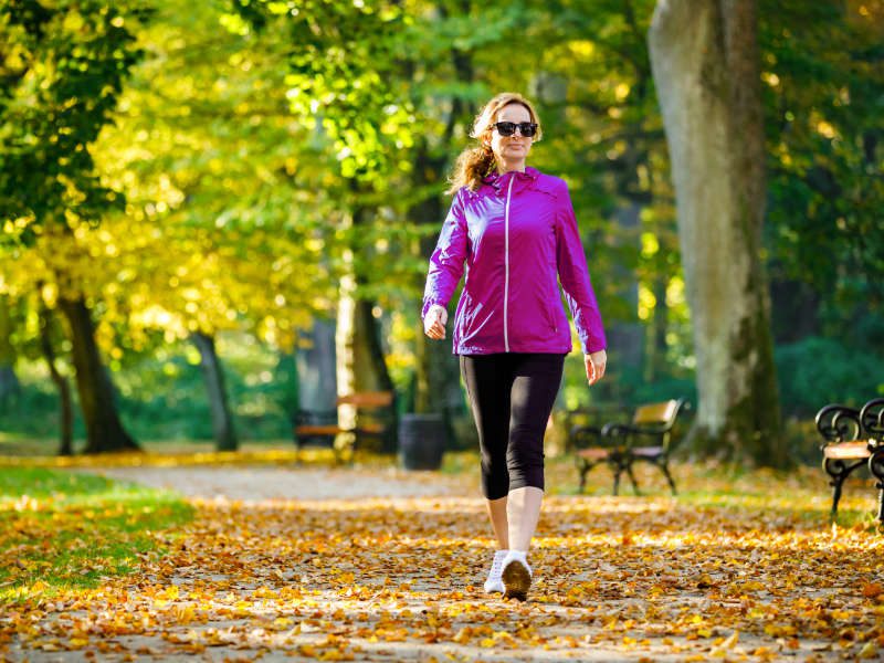 Mid aged women walking in a city park